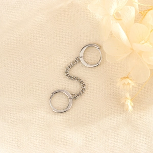 Minimalist s925 silver chain link double loop earrings with polished finish on fabric