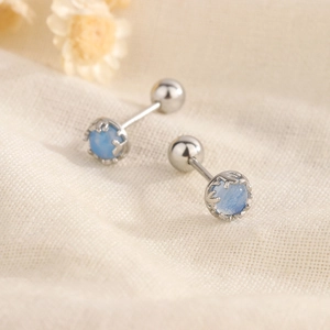S925 silver stud earrings with blue moonstone and screw back on linen fabric