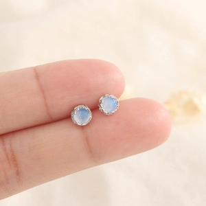 Moonstone S925 sterling silver stud earrings with blue gemstone crown setting