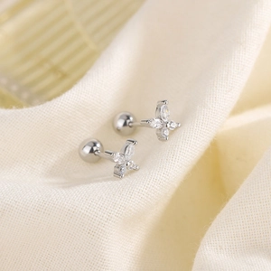 Silver butterfly zircon stud earrings with secure screw ball back on knit fabric