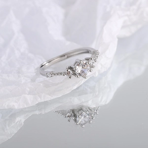 Minimalist silver zircon open ring featuring a sparkling round center stone and side gems