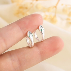Chic 925 sterling silver snake hoop earrings with green gemstone eyes for a trendy look