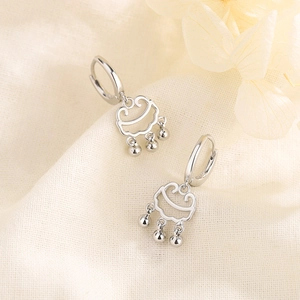 S925 sterling silver lock earrings with delicate triple bead tassels on beige background