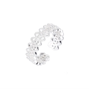 Close-up of S925 sterling silver ring featuring hollow heart lace and beaded textures