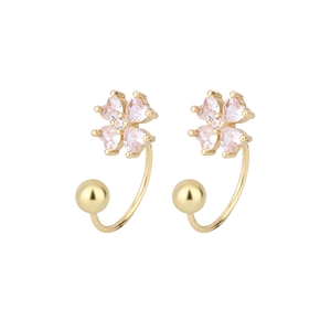 Detail of gold four-leaf clover stud earrings with pink heart crystals and C-shaped hook