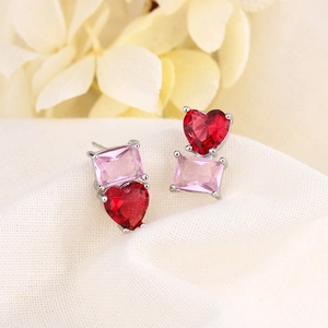 Boucles d'oreilles cœur en cristal bicolore avec pierres roses et base argentée