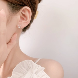 S925 sterling silver star and moon stud earrings shown on model for a minimalist look