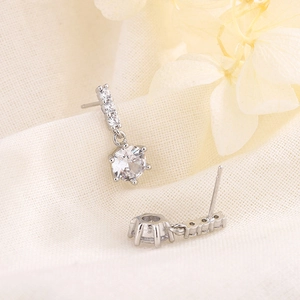 Elegant silver drop earrings with a six-prong round cubic zirconia and vertical accents