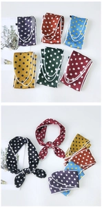 Detailed view of colorful polka dot satin scarves with white stitched borders and soft textures