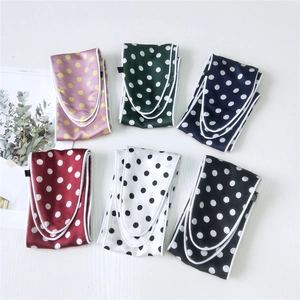 Set of six colorful polka dot silk scarves in various vibrant colors for hair and neck