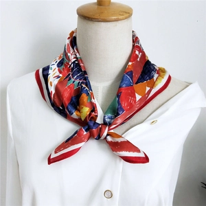 Abstract multi-color mulberry silk square scarf styled as a necktie on a white shirt