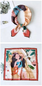 Detail of silk square scarf featuring a hand-painted girl and cat picnic illustration