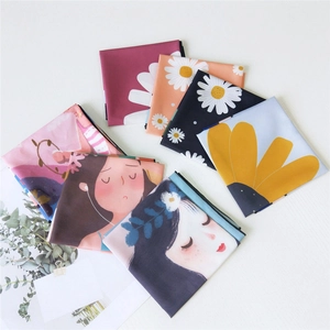 Floral print silk square scarf set with daisy and artistic girl illustrations on white wood