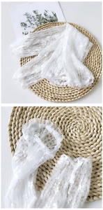 Close-up of floral lace sleeves with ruffled edges and elastic wrist cuffs for women