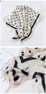Close-up of lightweight polka dot square scarf with premium fabric texture detail
