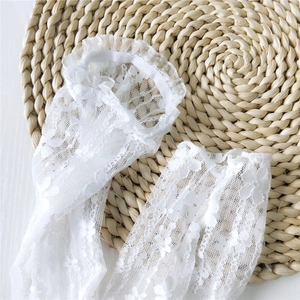 Elegant white lace arm sleeves with floral pattern and ruffled elastic cuffs for women