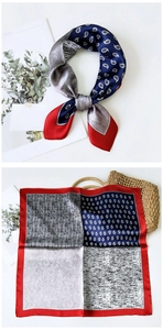 Detailansicht eines Maulbeerseide-Vierecktuchs mit Paisley-Muster und rotem Saumrand