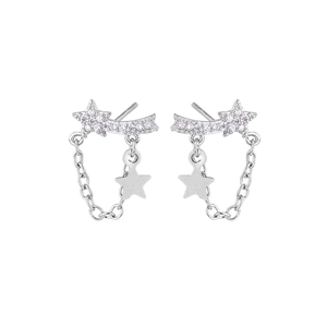 Detailed view of silver star earrings with tassels and shimmering zircon inlay