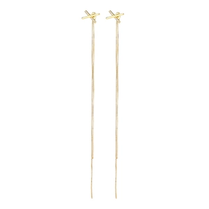 Detailed close-up of golden tassel drop earrings with a zircon-encrusted X-shape design