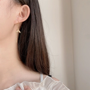 Elegant gold fishtail earrings with sparkling zircon dangles and long tassel chain