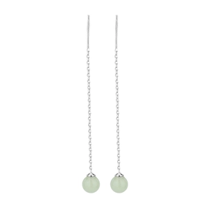 Detail of silver long chain earrings featuring round light green faux jade beads