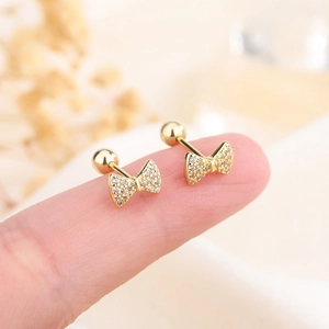 Miniature gold bow stud earrings with zircon inlay and secure screw back closure