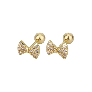 Macro detail of gold bow stud earrings with sparkling pave zircon and screw ball back