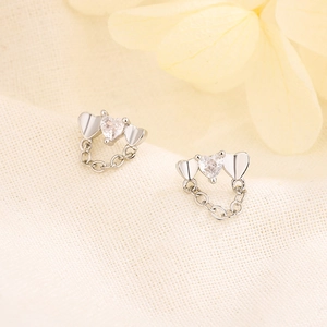 Elegant S925 silver heart tassel earrings with zircon crystal on beige fabric