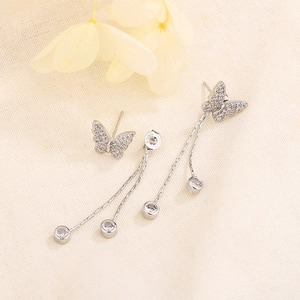 Sparkling S925 silver butterfly tassel earrings with cubic zirconia stones on fabric