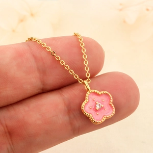 Elegant gold-plated cherry blossom necklace featuring a pink enamel pendant with a center zircon