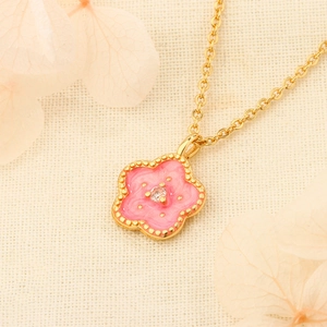 Elegant cherry blossom necklace with pink flower pendant and sparkling crystal accent