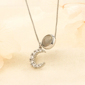 Minimalist moon pendant necklace with grey stone and sparkling cubic zirconia details