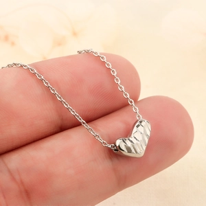 925 silver heart pendant necklace with textured geometric facets on a thin chain