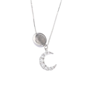 Minimalist silver moonstone crescent necklace featuring blue labradorite and crystal pavé