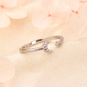 Elegant star and moon open ring with silver hammer texture and cubic zirconia crystals