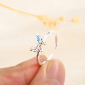 Macro view of butterfly ring with colorful marquise stones and adjustable silver band
