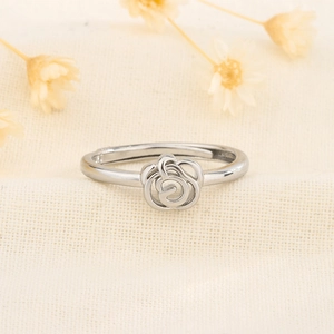 Elegant S925 silver rose ring with adjustable open band on a soft fabric background