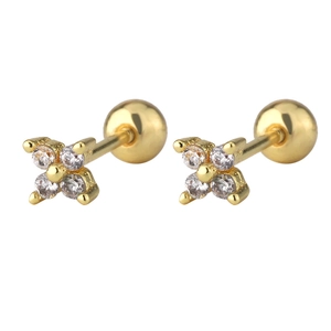 Detailed macro view of gold clover earrings with cubic zirconia and screw-back ball closures
