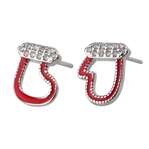 Macro shot of silver stud earrings with red enamel coating and two rows of white zircons