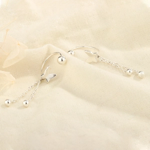 Elegant S925 silver butterfly tassel earrings with dual chains on linen background