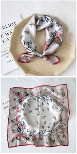 Detail of square silk scarf featuring champagne satin finish with vintage floral print