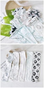 Close-up of lightweight cooling ice silk sun sleeves in assorted floral prints with packaging