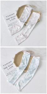 Close-up of pink and blue ice silk cooling sleeves with stylish printed cuff bands