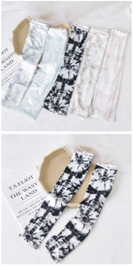 Close-up of tie-dye ice silk cooling sleeves with elastic Fashion lettered cuffs