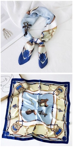 Detail of elegant equestrian print silk square scarf with horse saddle and chain patterns