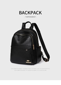 Close-up of black backpack featuring woven texture, gold zippers, and kangaroo metal logo