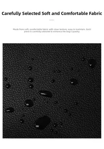 Detailed close-up of waterproof black lychee grain leather texture with water droplets