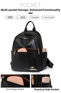 Close-up of crocodile-embossed leather backpack with gold kangaroo logo and zipper pocket