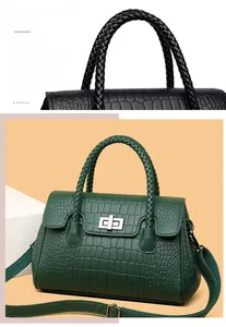 Close-up of crocodile embossed leather texture with woven handles and metal twist lock