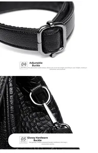 Detail of adjustable gunmetal buckle and crocodile embossed leather texture on black handbag
